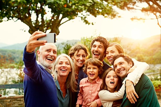 Cheerful-family-taking-selfie